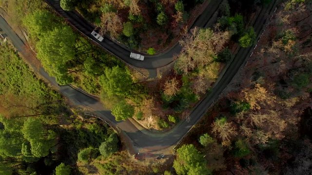 Aerial Top-Down Zoom-Out shot of the  Highway in the Hills Connecting Bir and the top of Paragliding spot in Billing, Himachal Pradesh, shot with a drone in 4k.