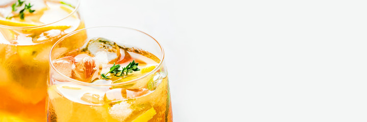 Iced tea with ice, mint and lemon. Refreshment cold summer drink. Close up shot. Banner with copy...