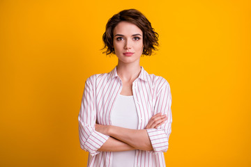 Fototapeta premium Photo of attractive chief girl cross hands ready decide work decisions solutions wear striped shirt isolated over vivid color background