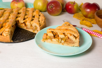 Autumn baking concept. Cooking baking traditional autumn Apple pie, light background copy space. homemade sweet dessert with apples and cinnamon