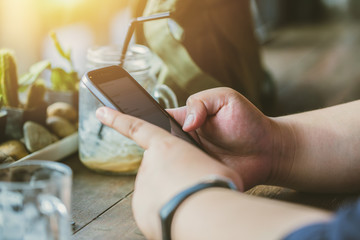 People hand typing on smartphone screen for read checking news in social media.