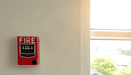 Fire alarm switch on white wall