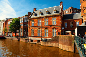 Fototapeta na wymiar Canal in Amsterdam with historic buildings
