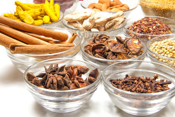 Aromatic spices on wooden spoons. Food ingradients.

