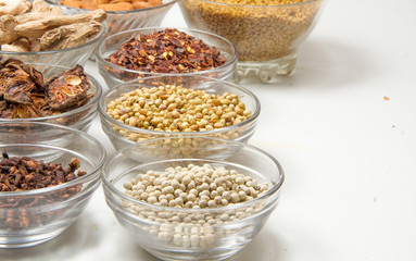 Aromatic spices on wooden spoons. Food ingradients.

