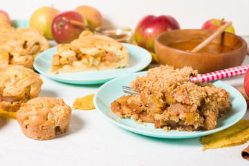 autumn baking concept with seasonal apples and cinnamon honey. crumble crisp apples on a plate on a light background with autumn yellow leaves.