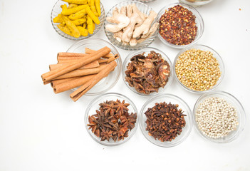 Aromatic spices on wooden spoons. Food ingradients.

