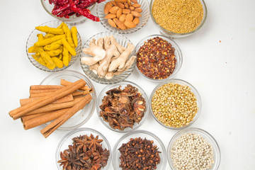 Aromatic spices on wooden spoons. Food ingradients.

