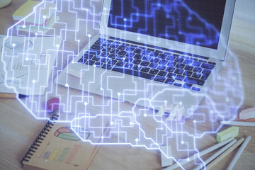 Multi exposure of work table with computer and brain hologram. Brainstorm concept.