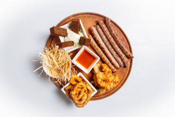 Top view on isolated beer appetizer snack platter 