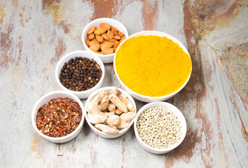 Aromatic spices on wooden spoons. Food ingradients.

