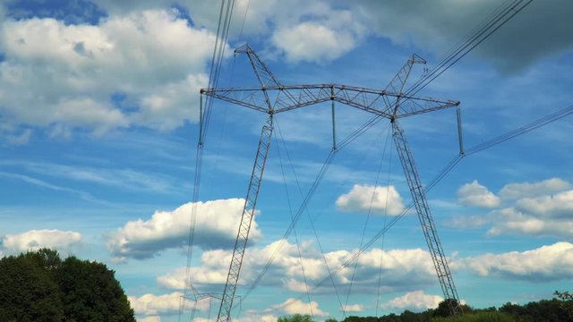 The 750 kV line support is a power distribution and transmission unit to the consumer. A large electric support stands on the sky background