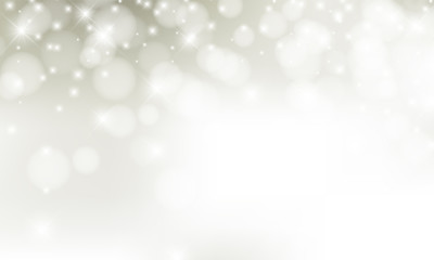 Christmas background with blur golden lights with snowflakes.