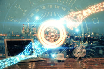 Multi exposure of blockchain theme hologram and table with computer background. Concept of bitcoin crypto currency.