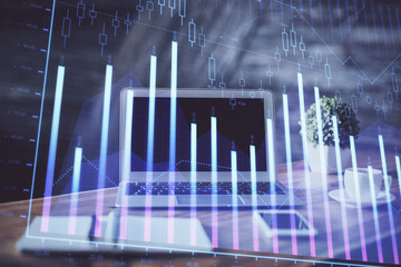 Stock market graph and table with computer background. Multi exposure. Concept of financial analysis.