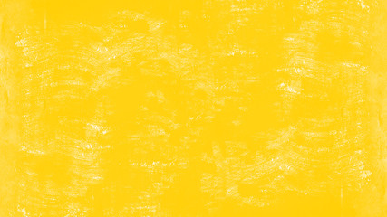 Abstract yellow painted colored spotted scratched paper texture background