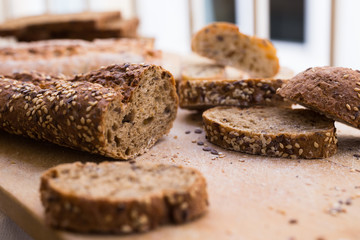 fresh loaf of bread on wooden board