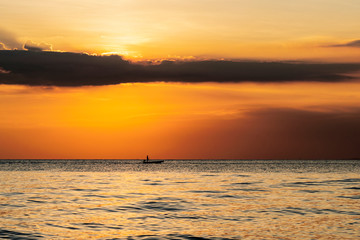 Fishermen catch fish at a beautiful sunset