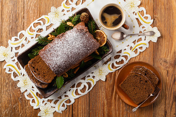 Homemade gingerbread cake. Christmas decoration. Top view. Natural wooden background.