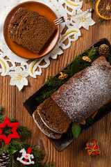 Homemade gingerbread cake. Christmas decoration. Top view. Natural wooden background.