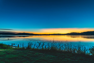 Vibrant Dawn radiates over the Bay