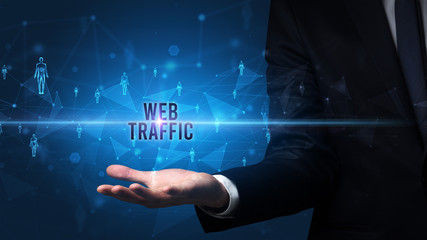 Elegant hand holding WEB TRAFFIC inscription, social networking concept