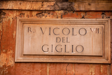 Street plate in the heart of Rome, Italy