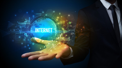 Elegant hand holding INTERNET inscription, digital technology concept