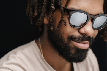 Pleased optimistic guy in sunglasses