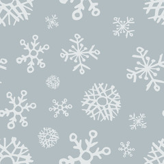 Seamless background of hand drawn snowflakes