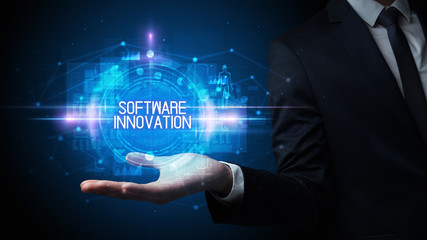 Man hand holding SOFTWARE INNOVATION inscription, technology concept