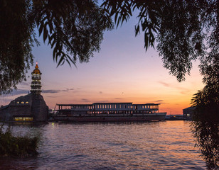 Evening view of the lighthouse and the water. Sunset mode.