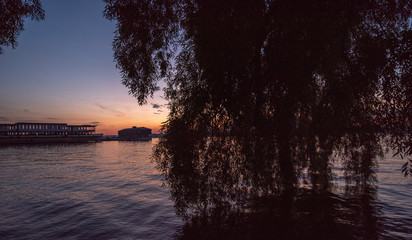 Evening view of the lighthouse and the water. Sunset mode.