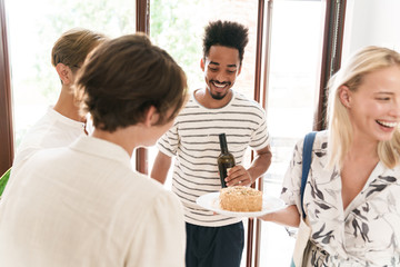 Happy friends celebrating a surprise birthday