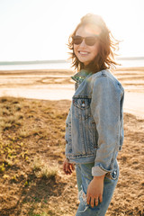 Beautiful smiling young girl wearing denim jacket