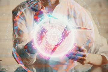 Tech theme hologram over woman's hands taking notes background. Concept of hightech. Double exposure