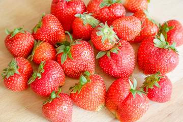Strawberries on wooden table, natural light