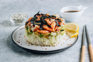 Spicy shrimp sushi stacks with layers of sushi rice, cucumbers and avocado spicy shrimp and furikake
