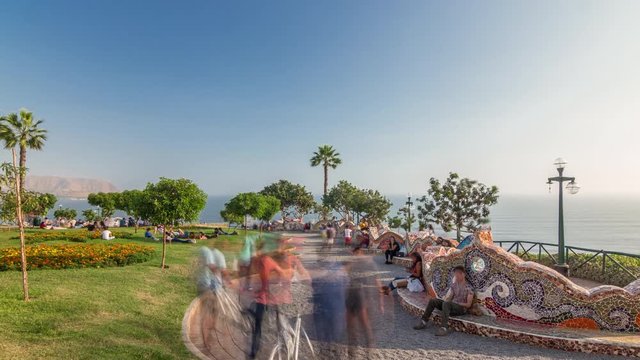 El Parque del Amor or Love park timelapse hyperlapse in Miraflores, Lima, Peru. The Kiss statue on a background with people sitting on mosaic bench and walking around