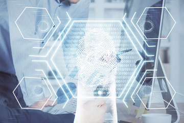 Fingerprint hologram with businessman working on computer on background. Security concept. Double exposure.