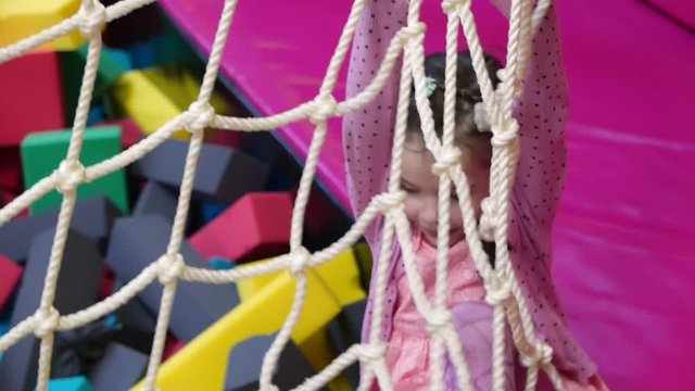 Little girl play in a game center