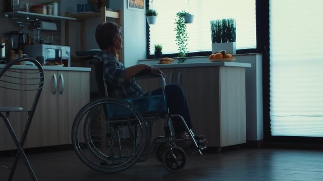 Silhouette of depressed handicapped senior woman in wheelchair from leg injury. Elderly disabled pensioner in rehab, paralysis and disability for invalid full of sorrow, worry and sad face. Retirement