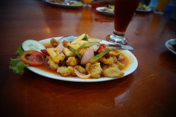Sweet and sour calamari, the basic ingredients of squid and fresh vegetables with soy sauce