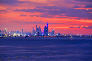 Amazing sunset view of Luxury hotel in Dubai with futuristic skyline in background