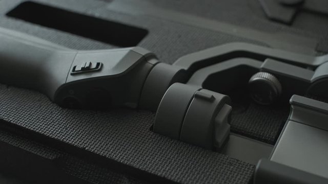 Opening a black gimbal hard case.