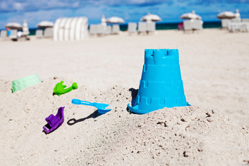 Sand children's toys on the beach during simmer vacation