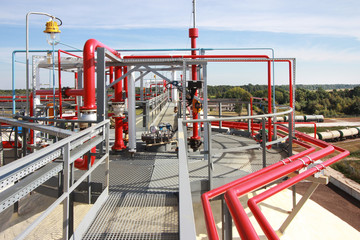 Fototapeta na wymiar Pipeline on a spherical storage tank in a chemical plant