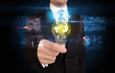 Fototapeta na wymiar Businessman holding lightbulb with SERVER SECURITY inscription, online security idea concept