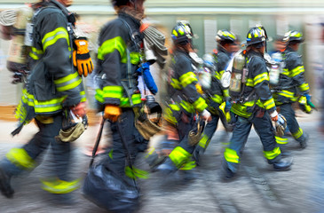 fire trucks and firefighters brigade in the city