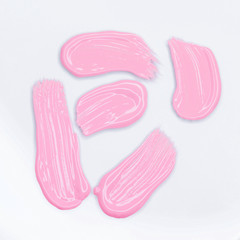 Pink Lipstick smudge isolated on white. Top view, flat lay.